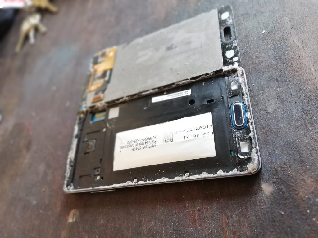 What was left of my old phone. Also, ignore my dusty desk.