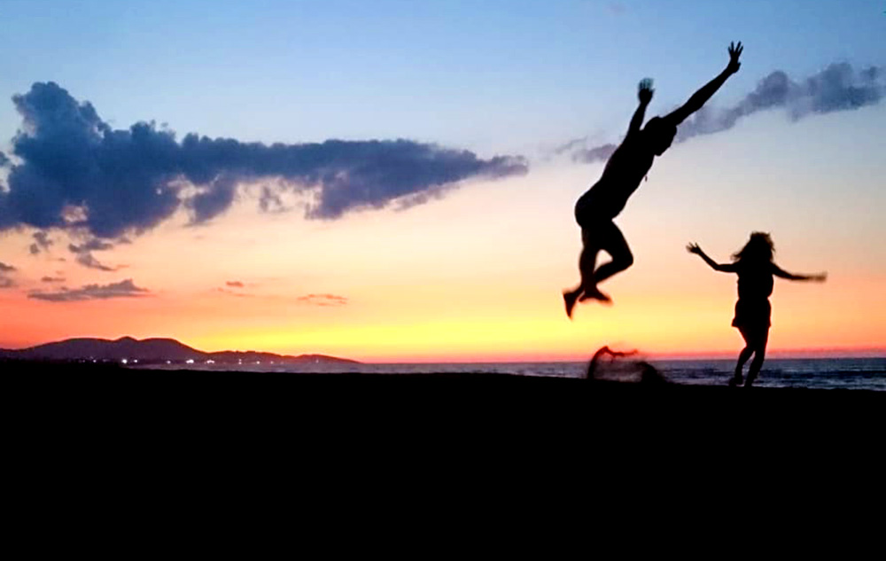 jumping happy beach balkan